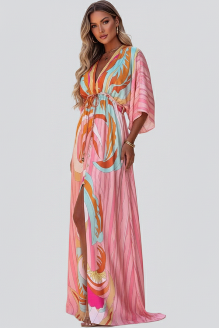 Stylish women's V-neck abstract print maxi dress in pink, belted for a flattering fit, perfect for warm weather fashion.