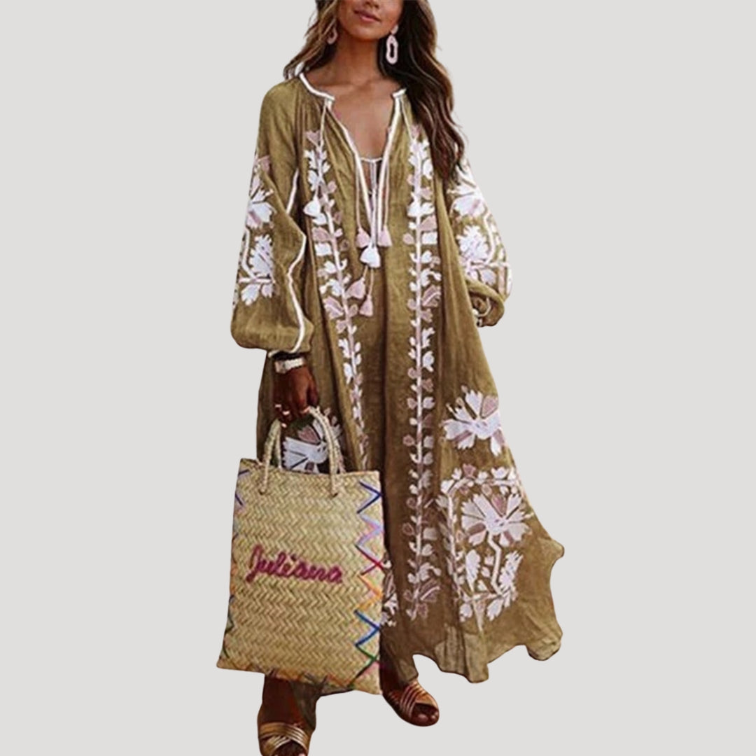 Flowing women's maxi dress with a stylish V-neck and comfortable long sleeves. Boho chic design, perfect for casual or holiday wear.
