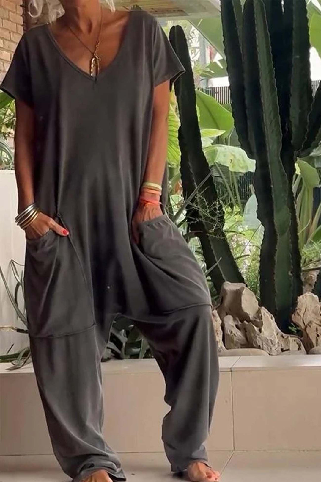Stylish V-neck short sleeve casual jumpsuit for women with convenient oversized pockets.