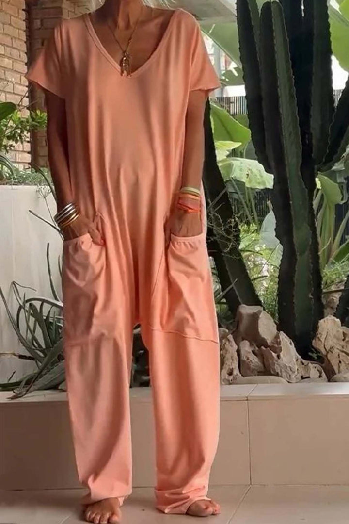 Easy wear women's V-neck short sleeve jumpsuit. Relaxed fit with functional oversized pockets.