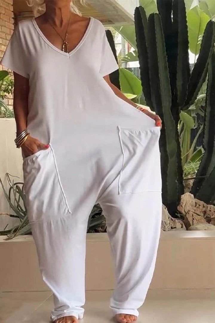 Women's casual V-neck short sleeve jumpsuit with oversized pockets. Comfortable, relaxed fit.