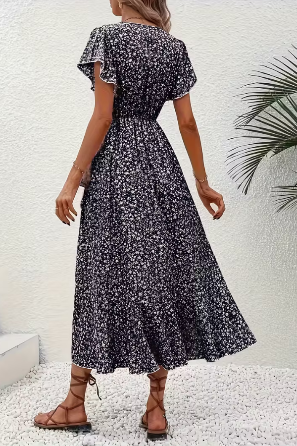 Women's V-neck floral midi dress, elegant style, fitted silhouette, ideal for day or evening.