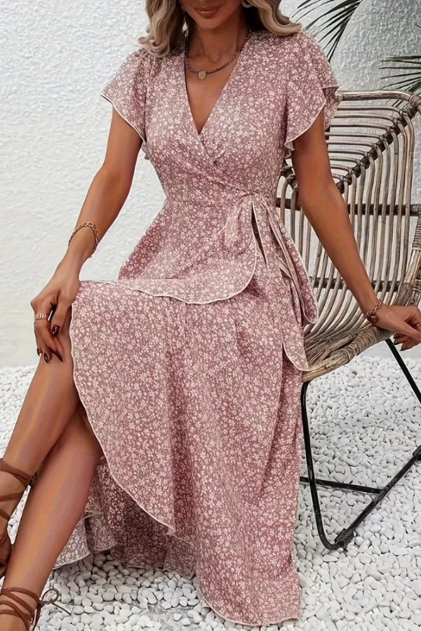 Stylish women's V-neck floral dress, asymmetrical hem, perfect for a chic summer look.