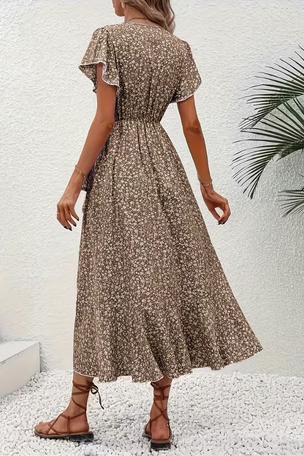 Stylish V-neck midi dress for women, vibrant floral pattern & flattering fitted silhouette.