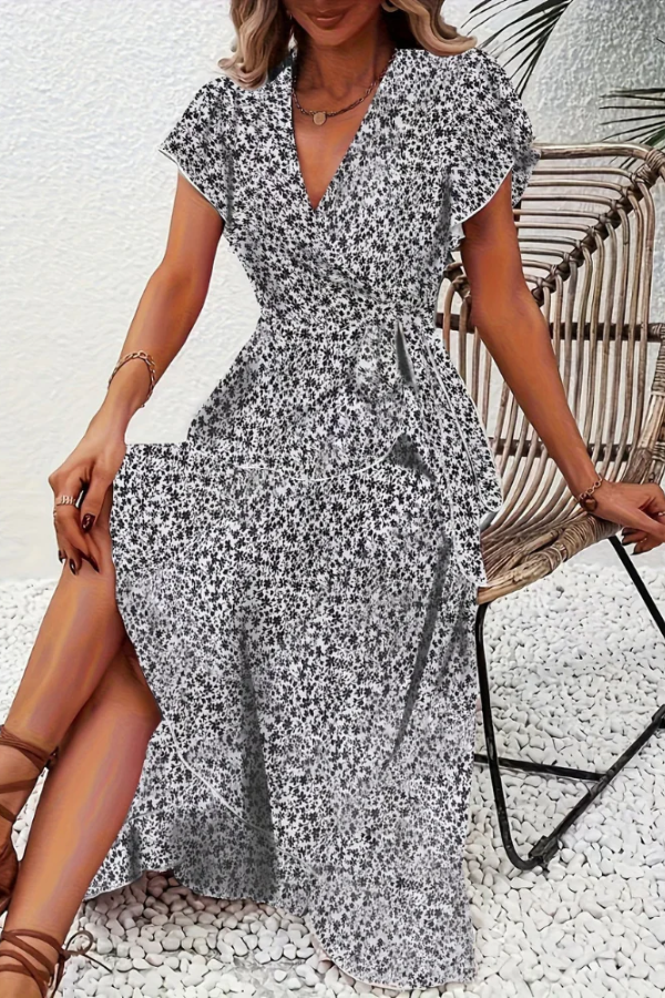 Elegant women's floral summer dress, V-neck, flowy fabric, perfect for chic occasions.