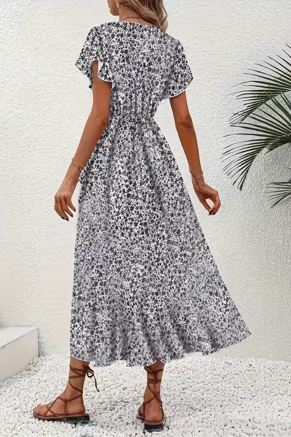 Flattering V-neck women's dress, elegant floral print, ideal for summer events.