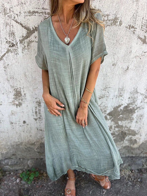 Casual women's v-neck midi dress featuring a relaxed, flowy fit, ideal for comfortable daily wear and summer style.