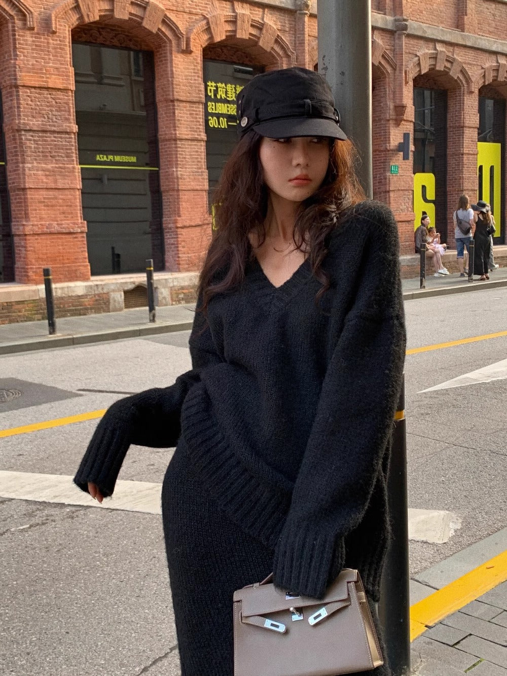 Women's V-neck knit sweater and midi skirt set; a comfortable, versatile long sleeve matching outfit.