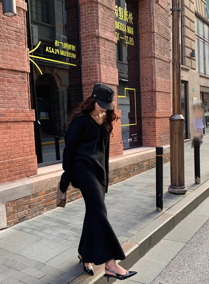 Women's comfortable V-neck knit long sleeve sweater and midi skirt set, a chic two-piece matching outfit.
