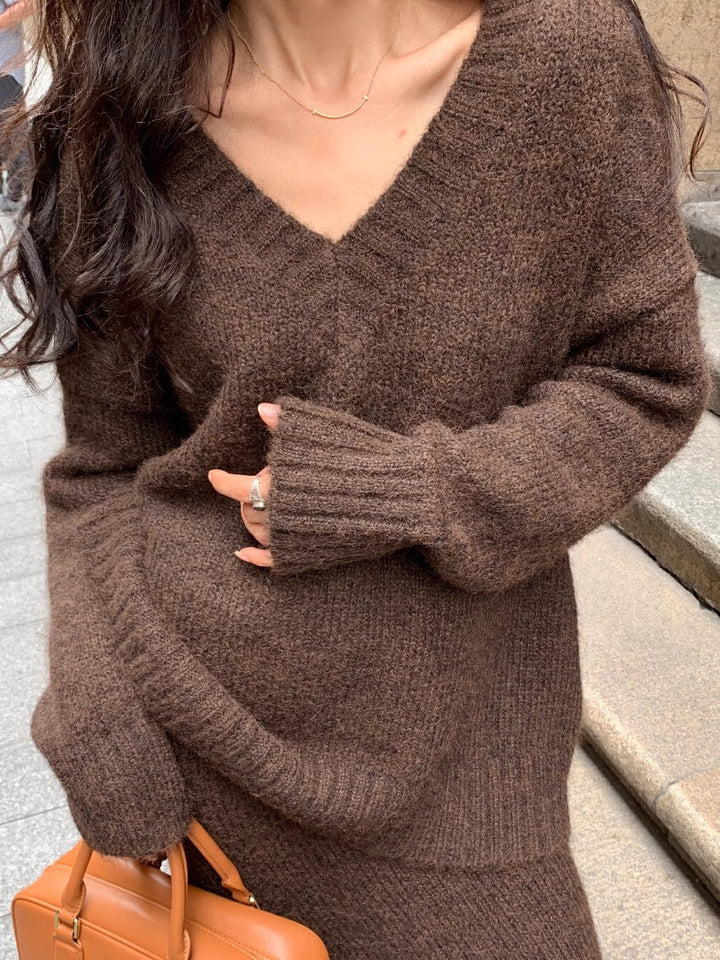 Elegant women's knit sweater skirt set with V-neck, long sleeves, and a flattering midi design for casual wear.