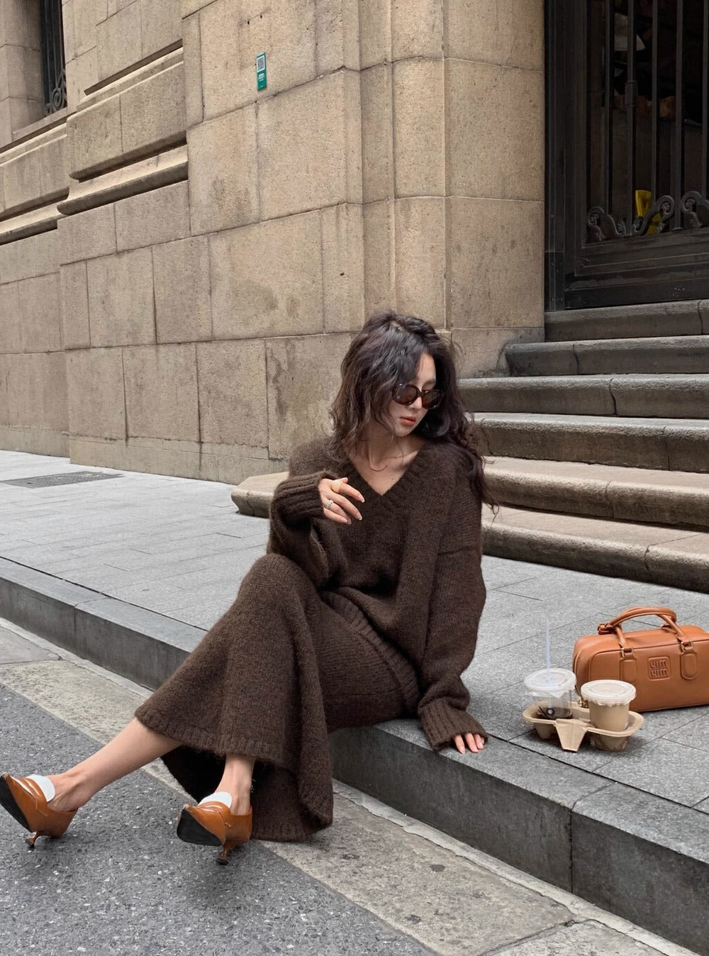 Comfortable long sleeve V-neck knit sweater and matching midi skirt set for women, an elegant two-piece outfit.