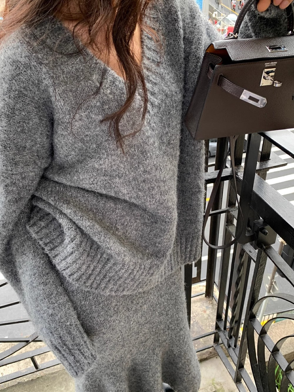 Versatile women's V-neck knit sweater and midi skirt set, a stylish two-piece matching outfit for any occasion.