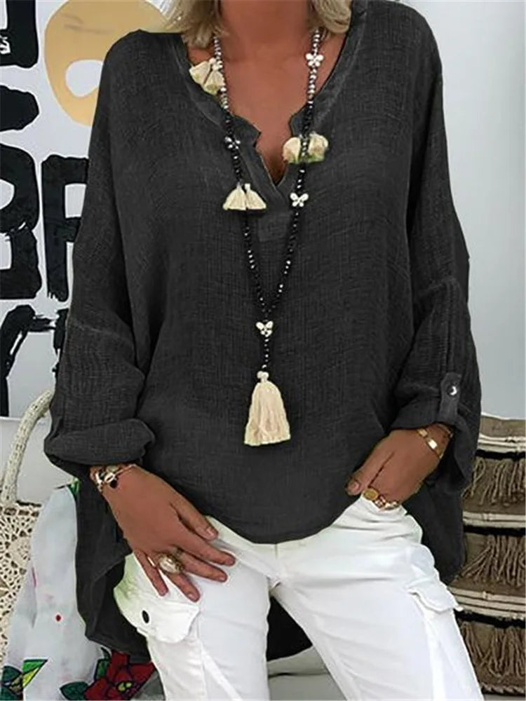 Plus size women's V-neck long sleeve blouse, relaxed fit top, casual and comfortable everyday fashion.