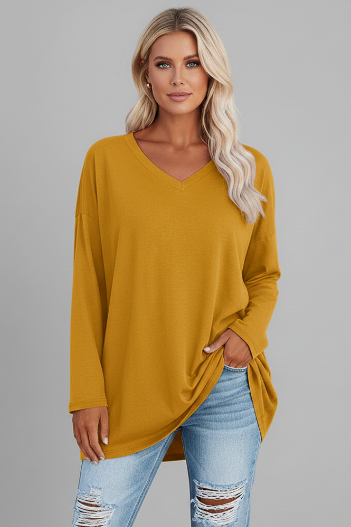 Versatile women's apparel: a chic V-neck long sleeve top with a relaxed, comfortable fit.