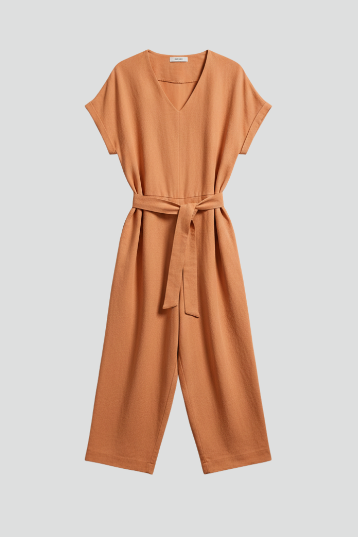 Women's V-neck long sleeve wide leg jumpsuit with tie waist. Elegant & comfortable one-piece fashion.