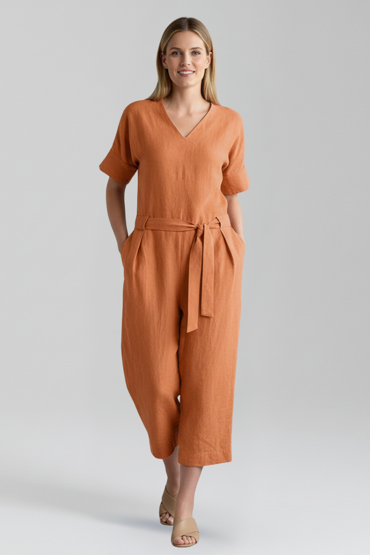 Model wearing a stylish women's V-neck long sleeve wide leg jumpsuit, perfect for casual or elegant wear.