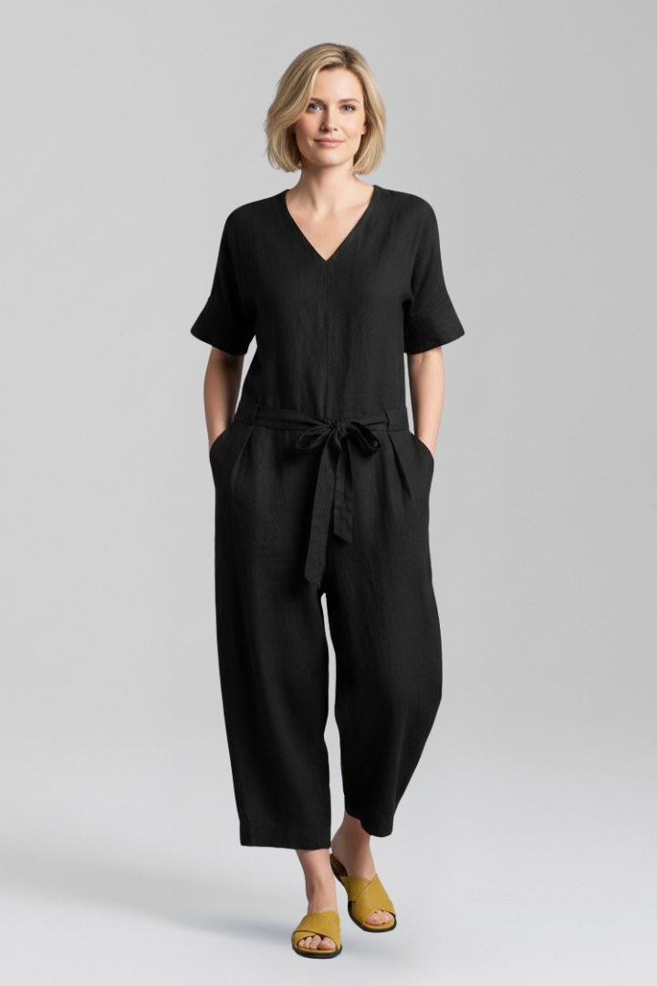 Back view of women's long sleeve wide leg jumpsuit, highlighting its comfortable fit & elegant one-piece style.