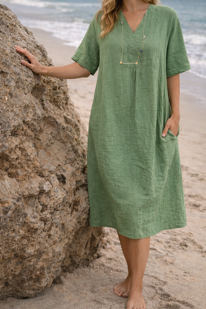 Elegant pink V-neck midi dress for women, featuring a loose fit and comfortable design for summer.