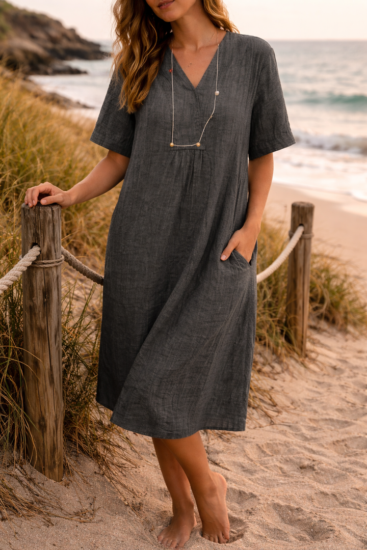 Beautiful blue V-neck midi dress with a loose, comfortable fit for women, ideal for elegant summer fashion.
