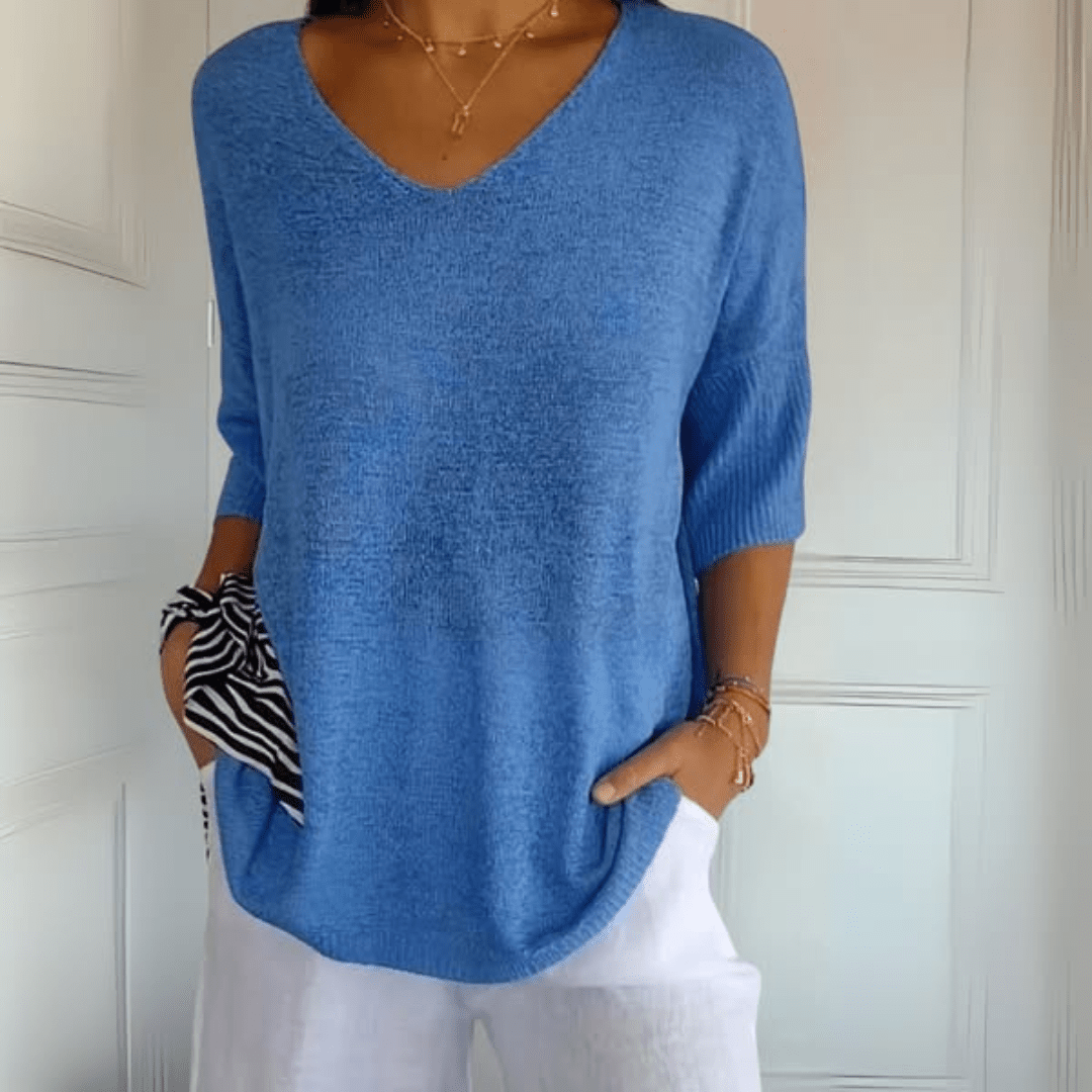 Chic women's loose V-neck sweater with 3/4 sleeves. Ideal for comfortable, relaxed spring fashion.