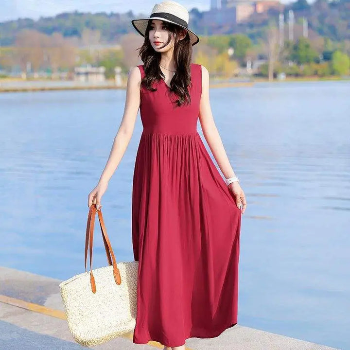 Women's V-neck maxi dress with tie waist and pockets. Perfect for summer, casual wear, or vacation.