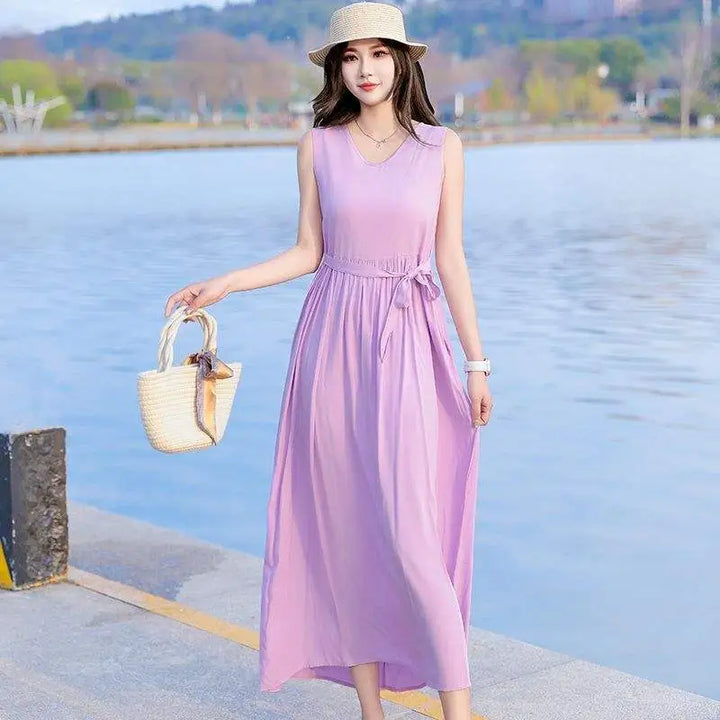 Elegant V-neck maxi dress for women. Features a flattering tie waist, pockets, and a flowy silhouette.