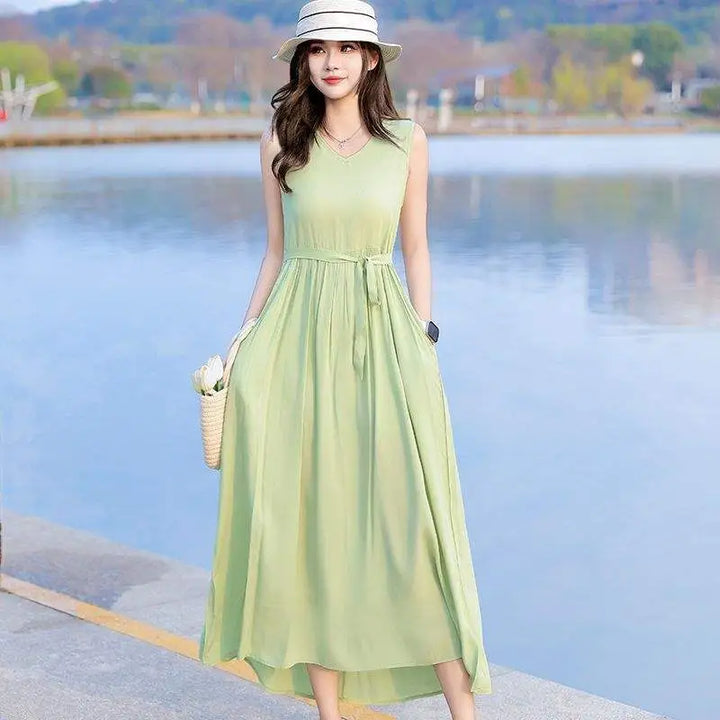 Stylish women's V-neck maxi dress with a flattering tie waist and essential pockets. Perfect for summer.