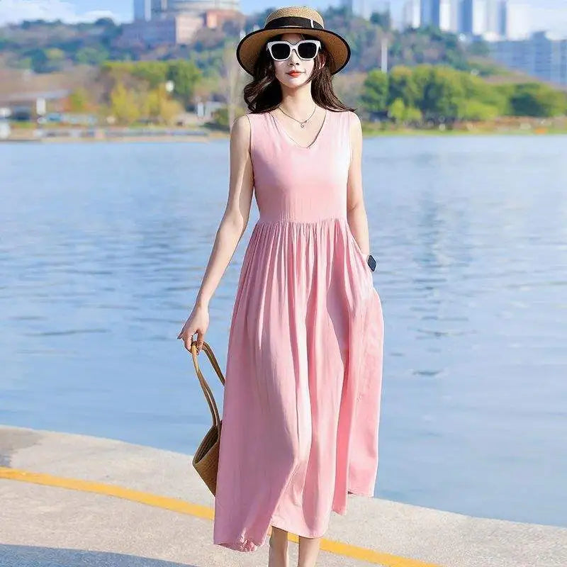 Beautiful women's sleeveless V-neck maxi dress, featuring a cinched tie waist and convenient side pockets.