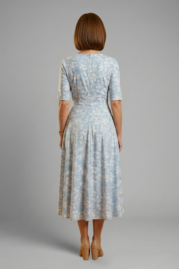 Elegant V-neck midi dress for women with short sleeves and useful pockets, suitable for various occasions.