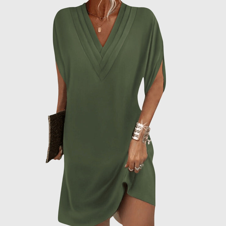 Relaxed fit women's v-neck mini dress. Loose cocoon style, short sleeve, ideal for everyday casual comfort and summer.