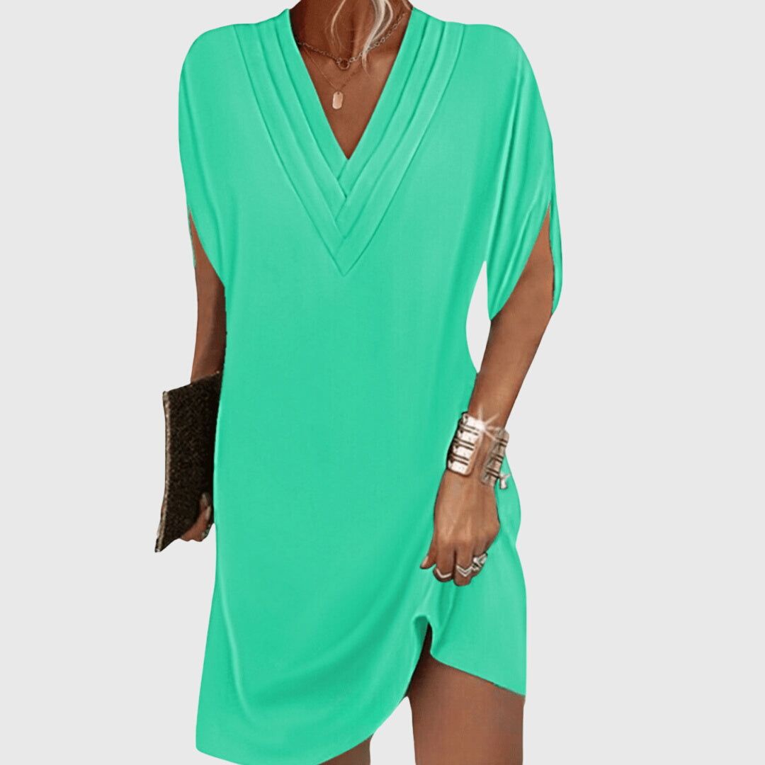Effortless women's v-neck mini dress, short sleeve. Relaxed fit for comfortable and stylish summer casual wear.
