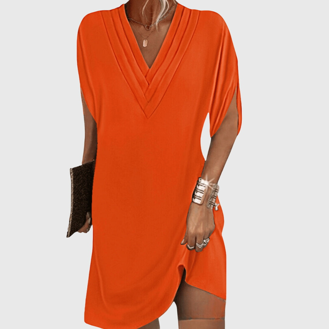 Women's v-neck mini dress, short sleeve. Loose, relaxed fit offers ultimate comfort for casual summer days.