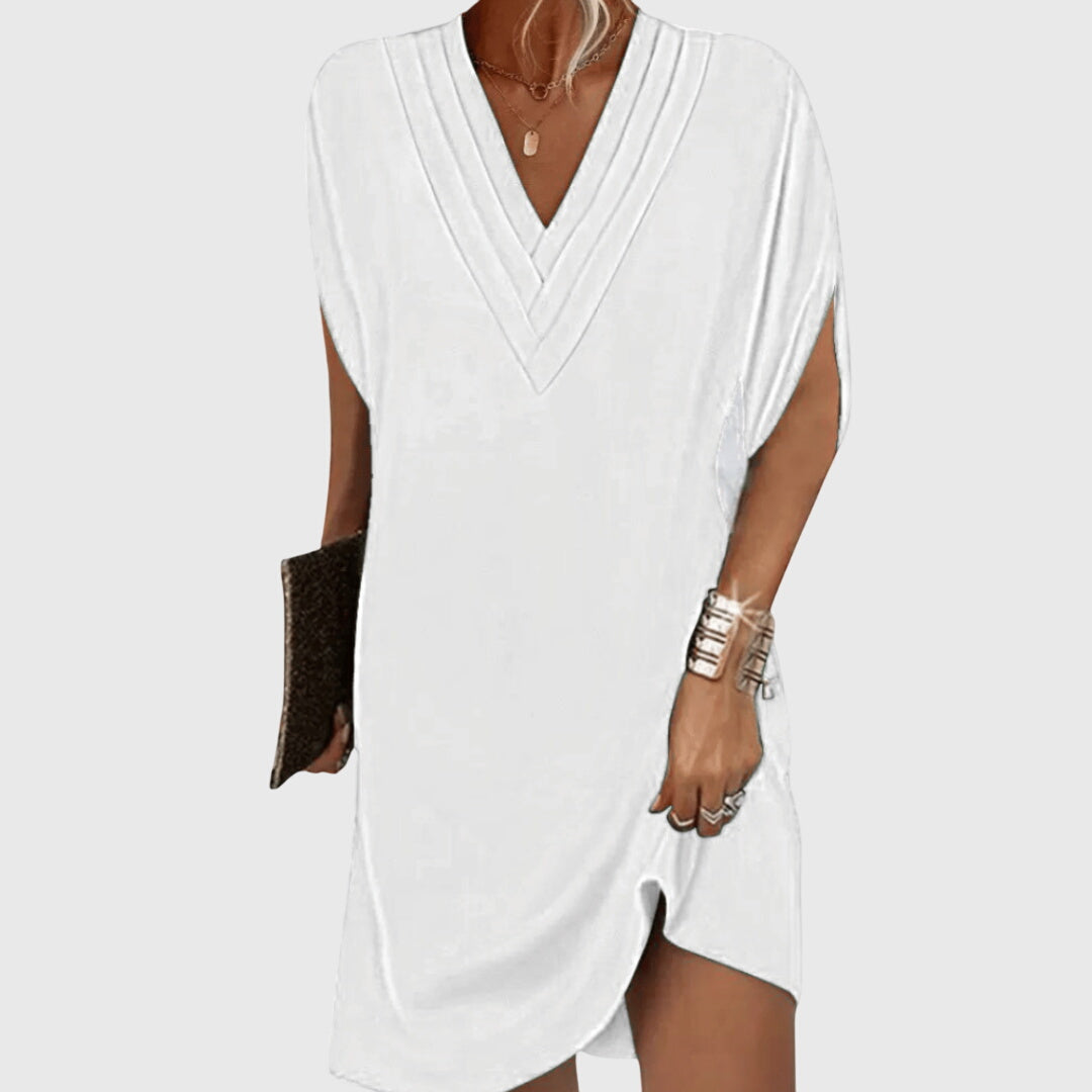 Stylish women's v-neck mini cocoon dress. Short sleeve, relaxed fit for versatile casual wear, summer or vacation.