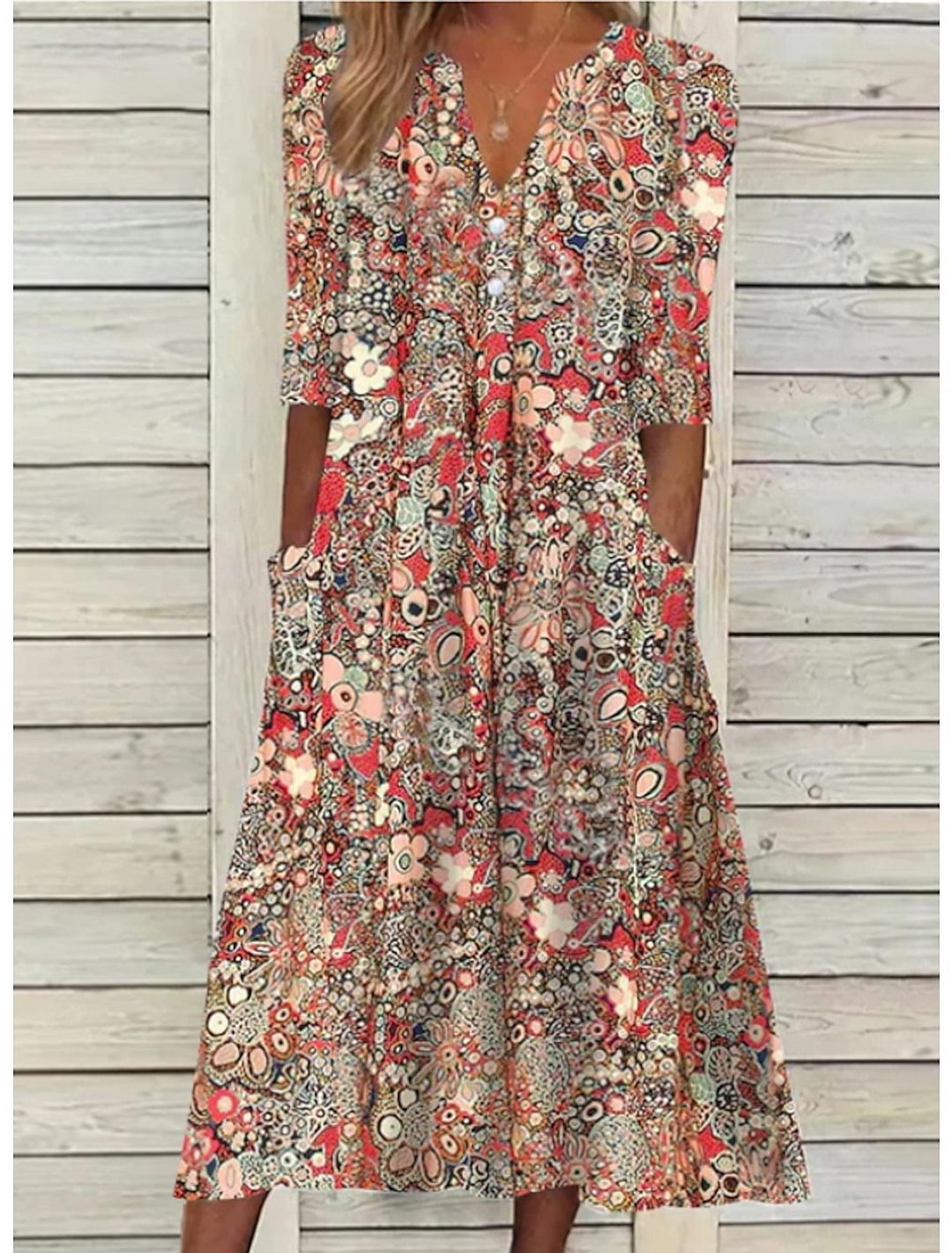 Women's V-neck printed midi summer dress with comfortable 3/4 sleeves & handy pockets.