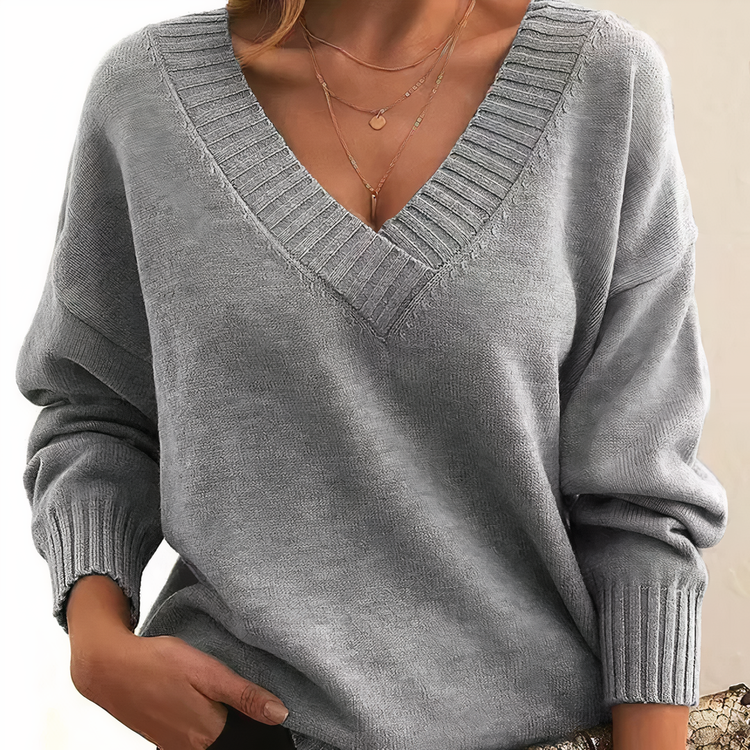 Soft women's ribbed V-neck sweater. Relaxed fit, long sleeve design for everyday wear.