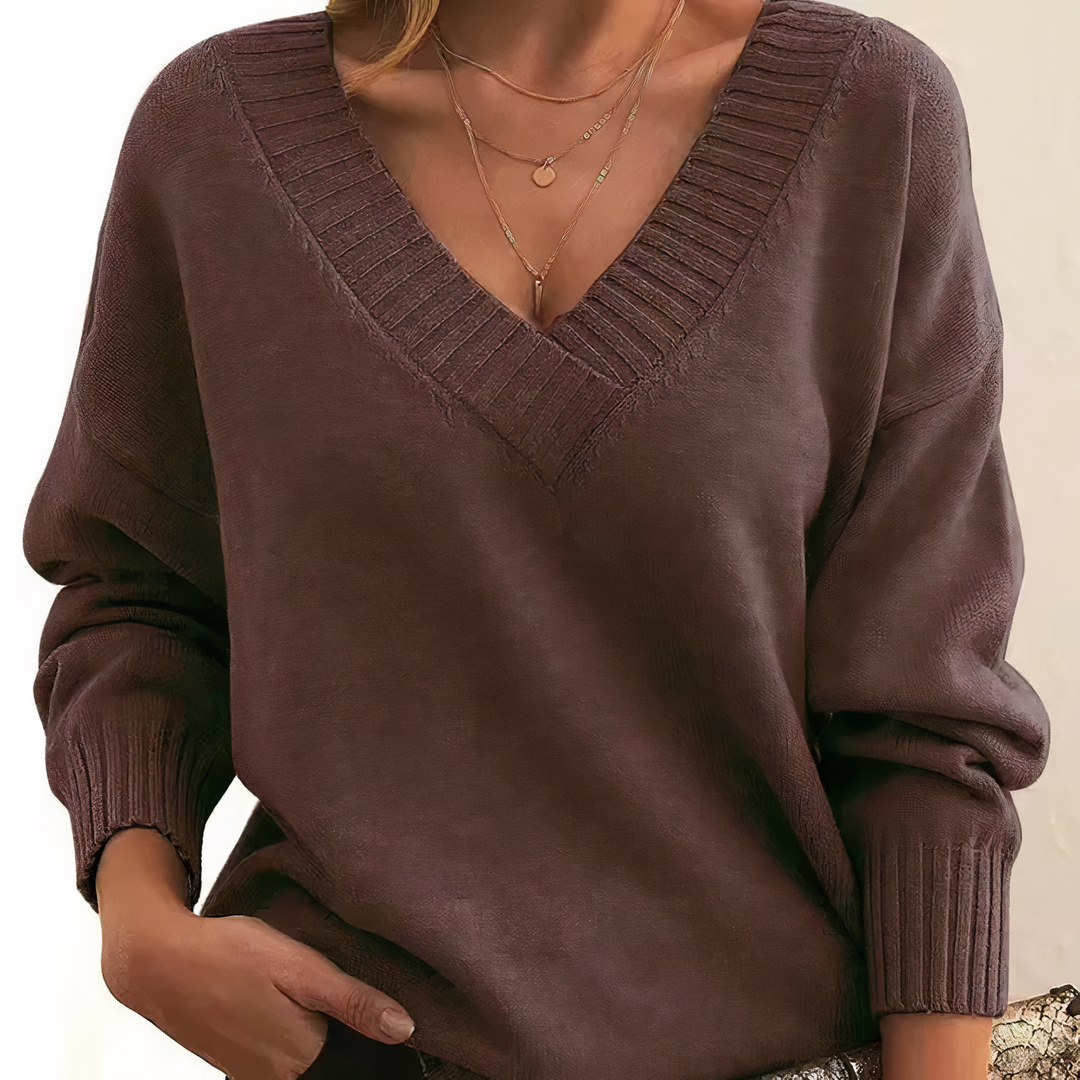 Stylish women's V-neck ribbed sweater, long sleeve. Versatile for casual & chic looks.
