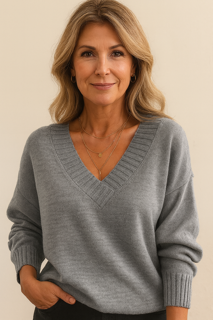 Chic casual V-neck ribbed sweater for women. Long sleeves, relaxed fit, versatile style.