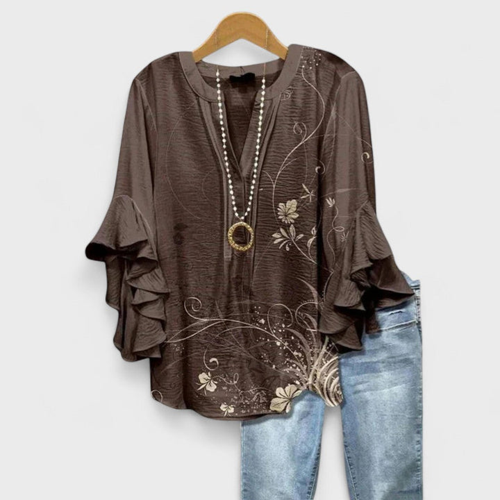 Elegant women's V-neck top with charming ruffle sleeves, ideal for spring fashion.