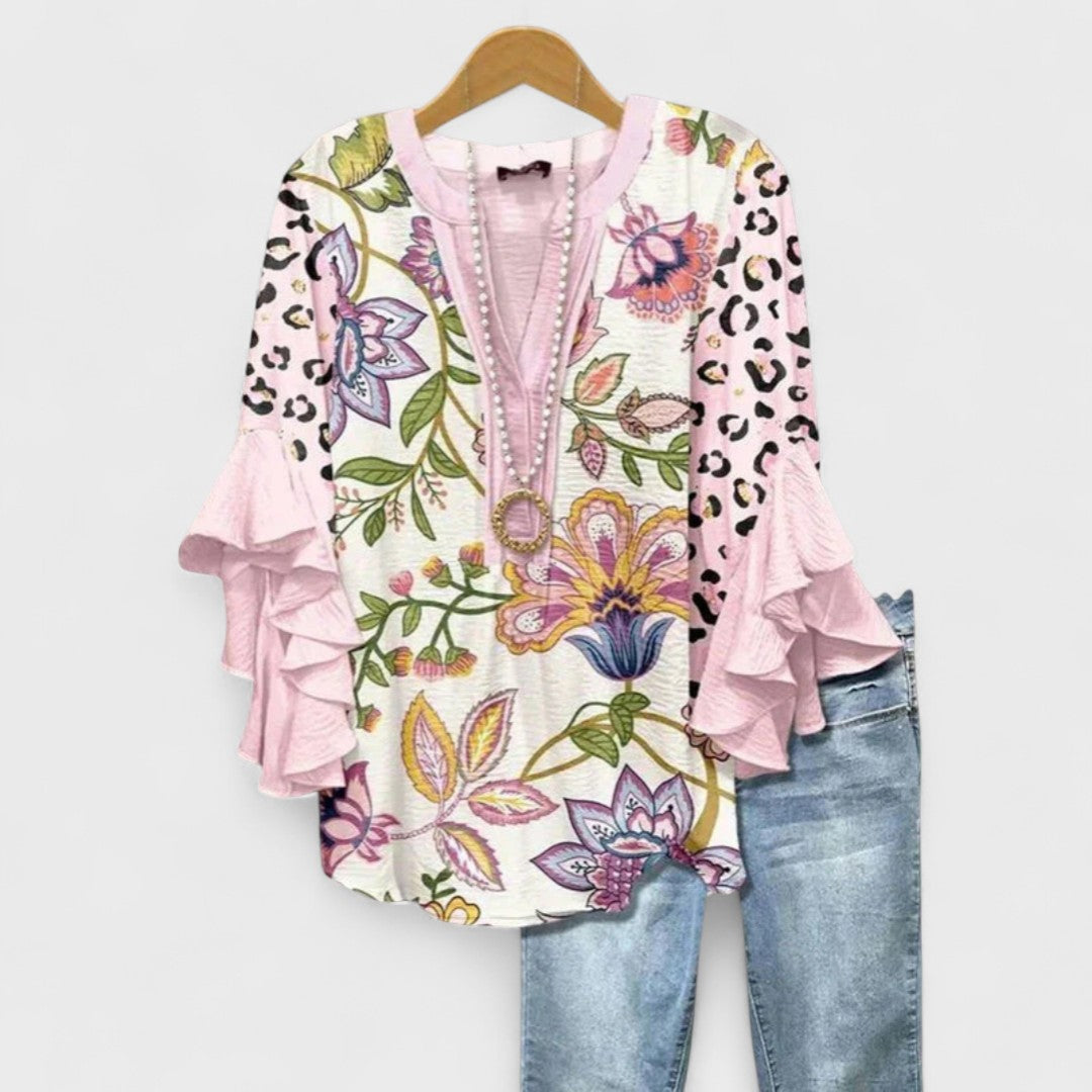 Chic V-neck top for women, modern design with stylish ruffle sleeves for spring fashion.