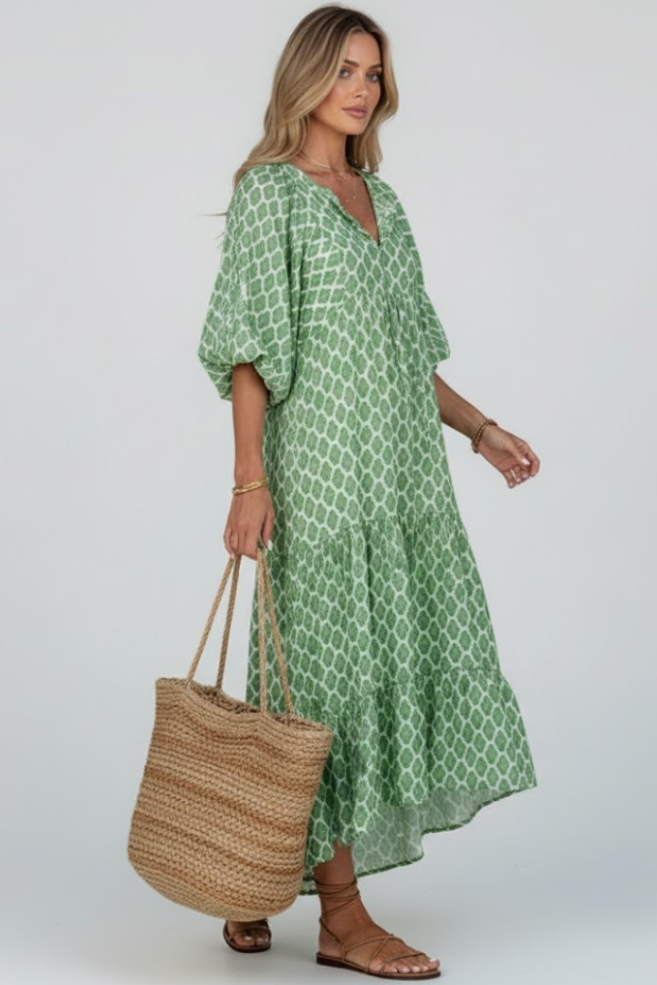 Printed women's V-neck maxi dress with short sleeves & flowy layered skirt for a stylish summer look.