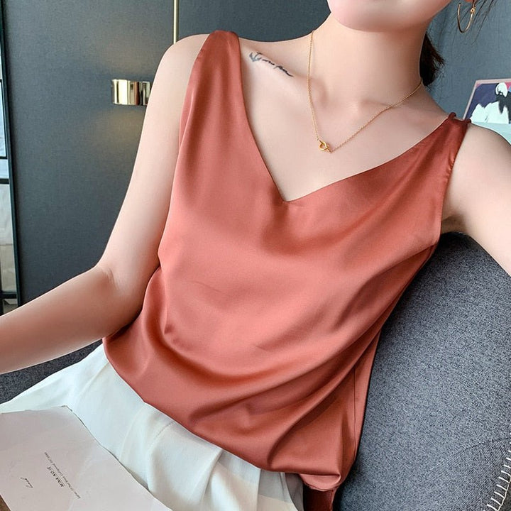 Effortless elegance in a women's v-neck tank top. Loose fit, sleeveless, essential for summer fashion.