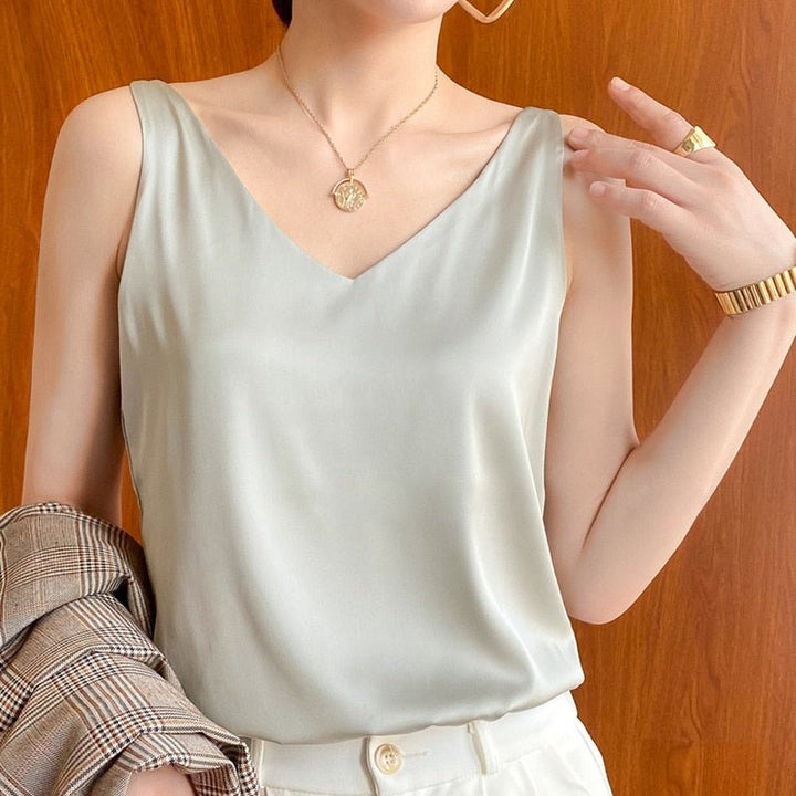 Stylish women's sleeveless top, V-neck design, offers a comfortable loose fit for everyday elegance.