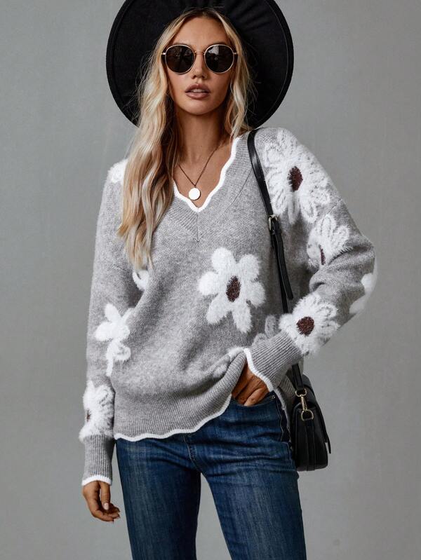 Relaxed fit women's V-neck sweater, ideal for cozy autumn fashion & stylish winter layering.