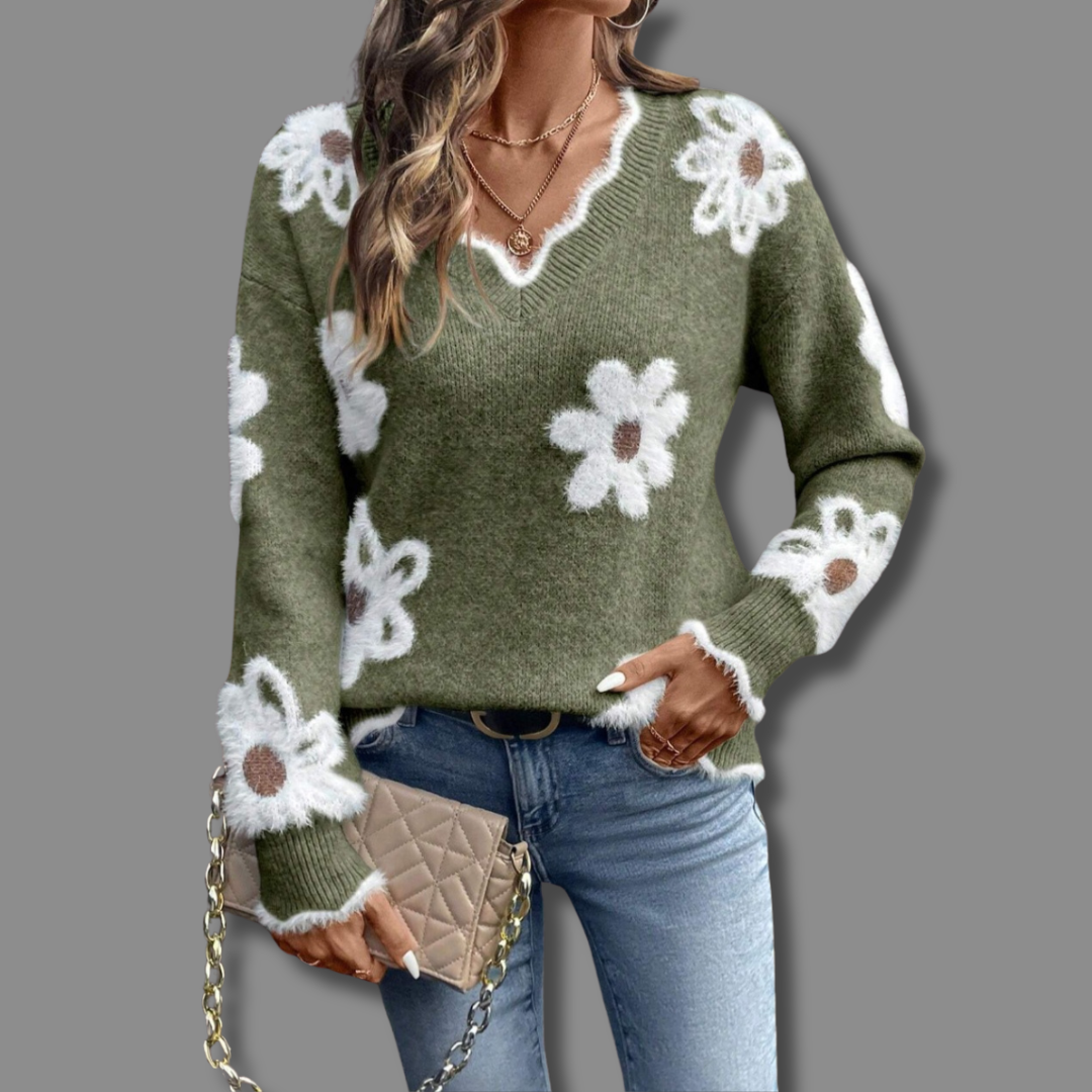 Model wearing a women's V-neck sweater with subtle textured floral pattern for chic autumn style.