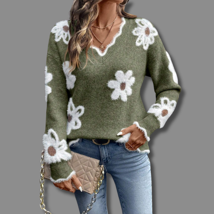 Model wearing a women's V-neck sweater with subtle textured floral pattern for chic autumn style.