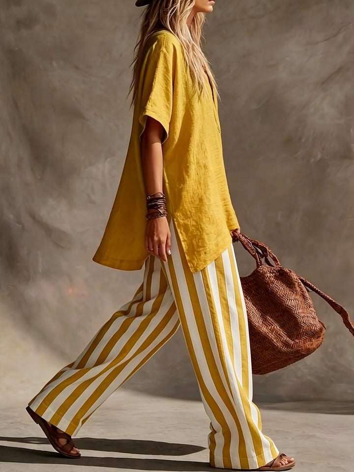 Effortless women's fashion: V-neck top paired with comfortable striped wide leg pants for summer.
