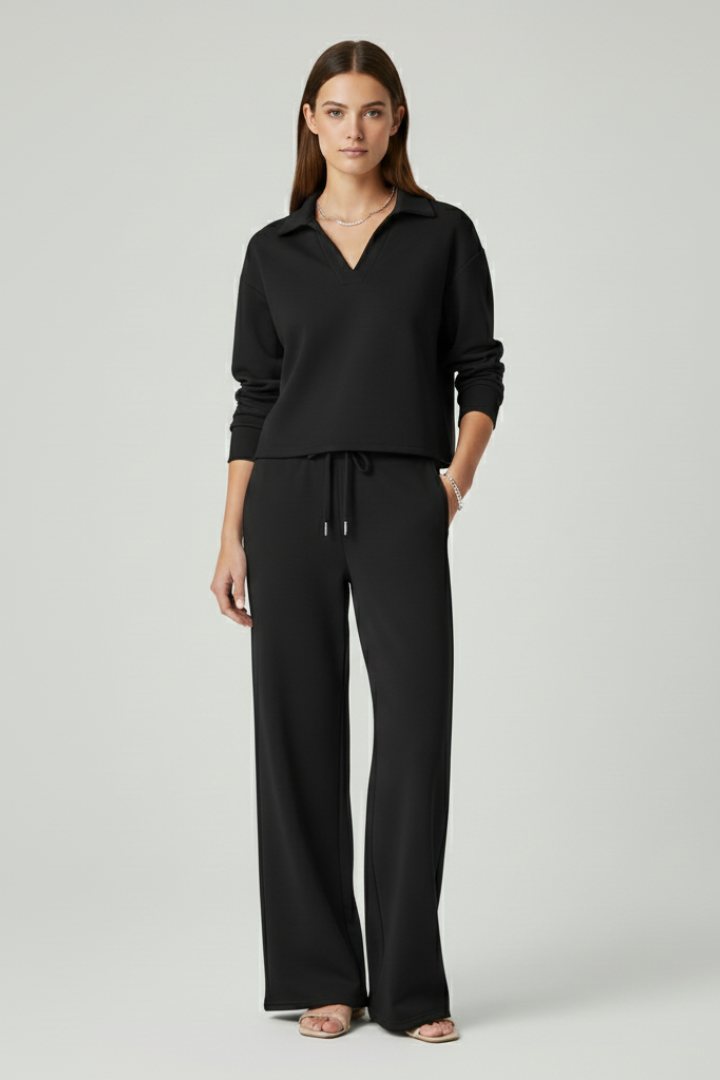 Complete women's ensemble: Stylish V-neck long sleeve top and wide-leg pants set. Effortless and chic.