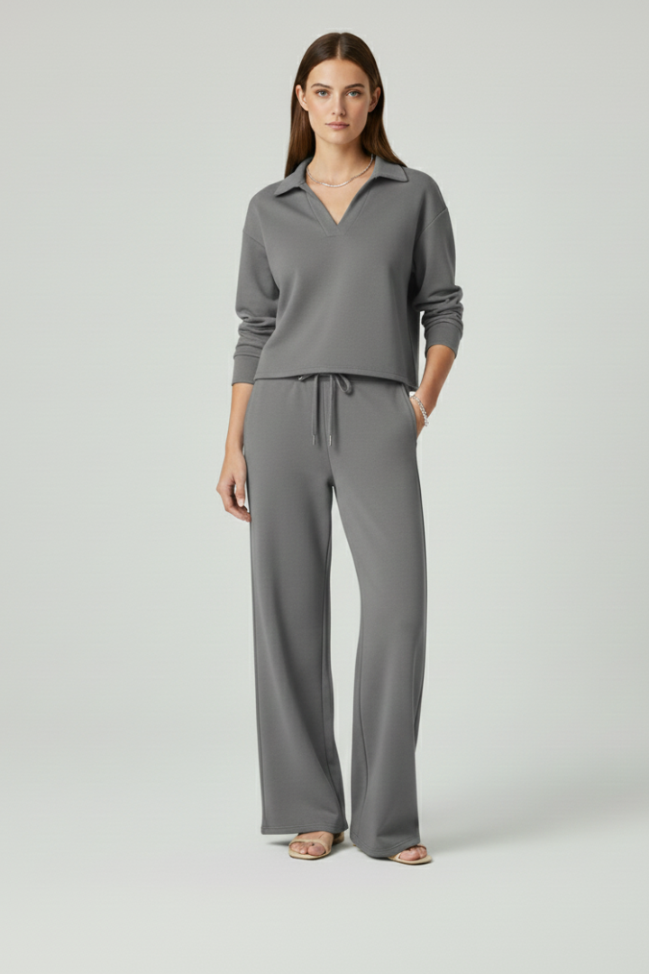 Relaxed yet refined women's set with a V-neck top and wide-leg trousers. Offers ultimate comfort & style.