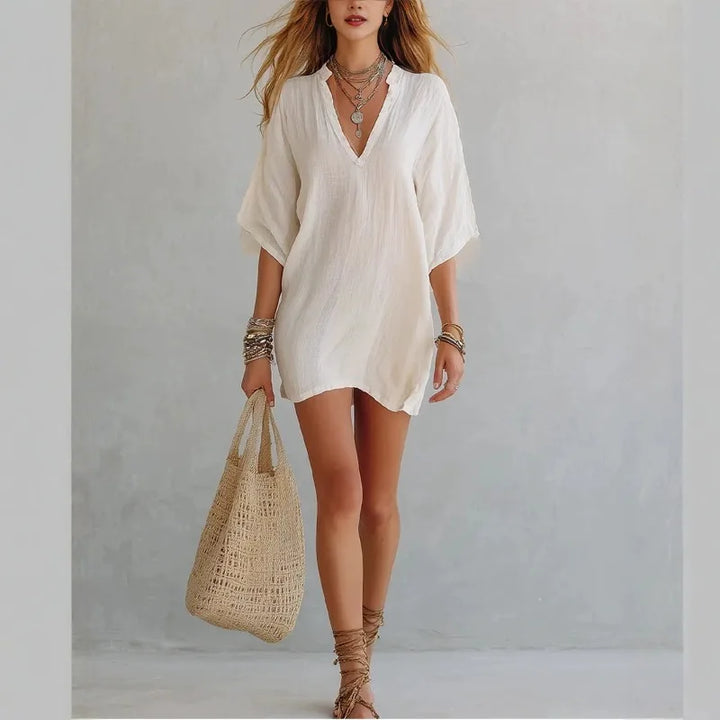 Effortless relaxed fit V-neck tunic mini dress for women, great for day or casual wear.