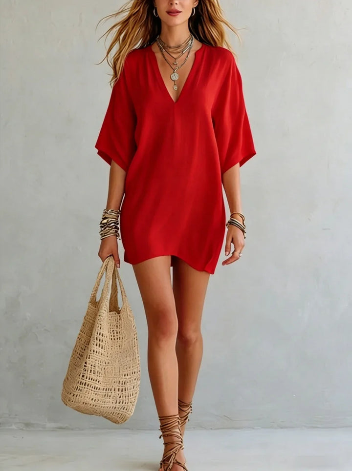 Women's short V-neck tunic dress with relaxed fit, versatile for beach, resort, or casual outings.